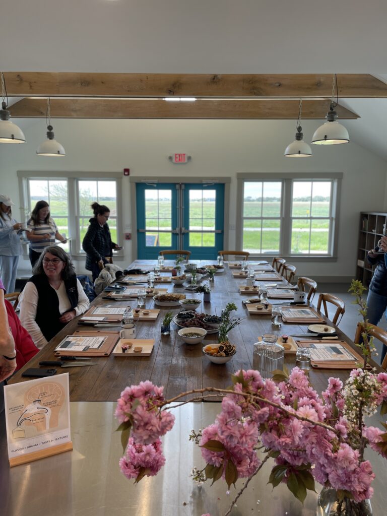 The table set-up at the FARM Institute at Katama Farm. Each participant had a station with a cutting board, handout materials, and a tray to take home their cheese board.